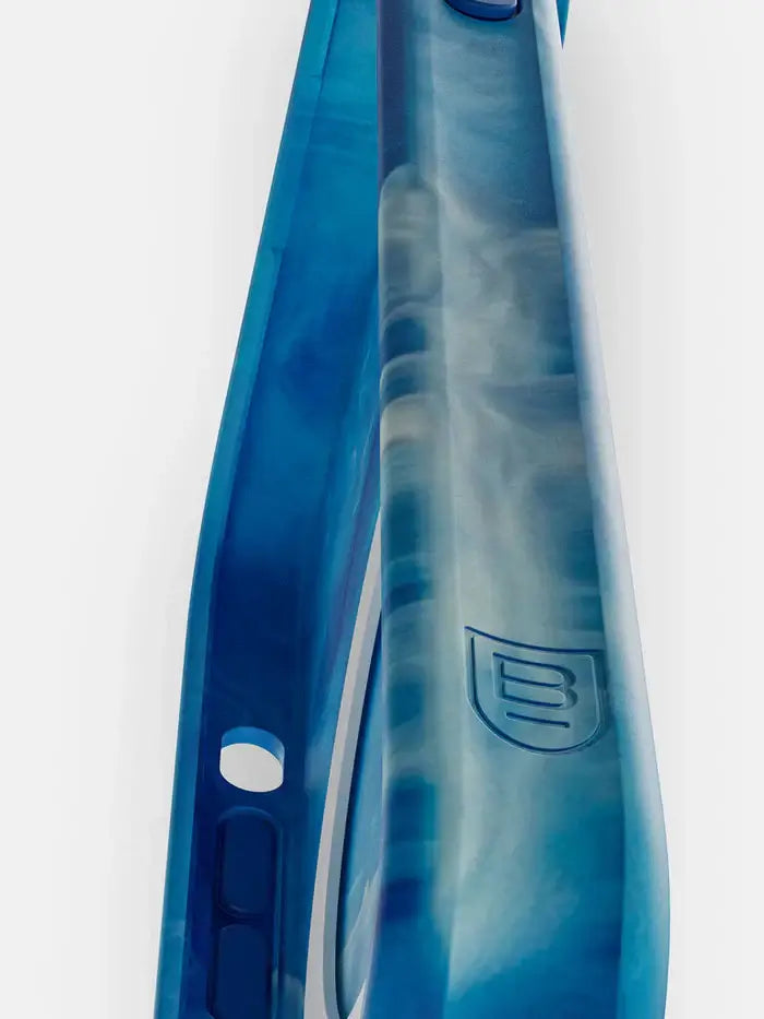 Side view of BodyGuardz Carve MagSafe iPhone 15 Pro Max case showing blue marble design and raised edges.